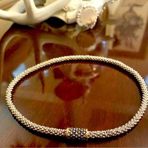 Silver tone. Modern textured design. Magnetic accent closure. 16 in.